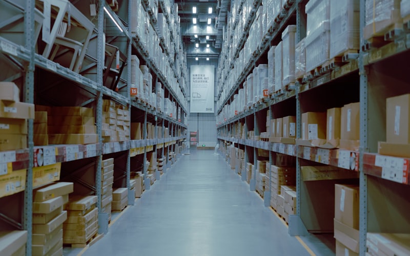 Warehouse aisle lined with stocked inventory shelves