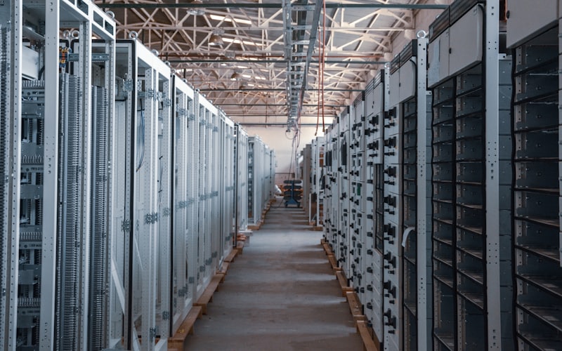 Aisle of server and equipment racks in a data center